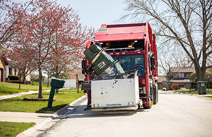 Tri-State Disposal garbage truck collecting trash